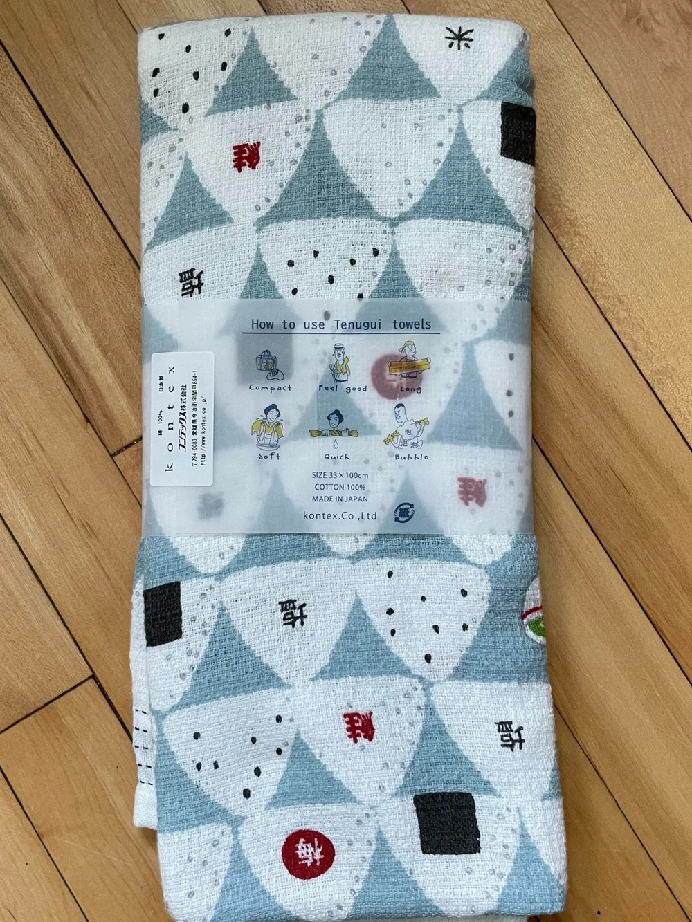 Kodomo Japanese Onigiri Tea Towel with white and blue triangular rice ball